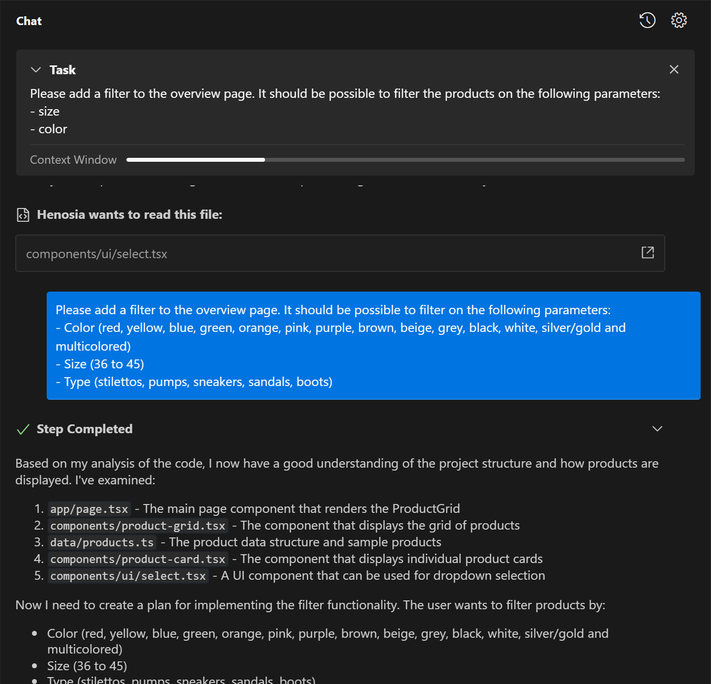 An example of a chat area showing a task box, a file henosia has interacted with, a blue message from the user and a description from Henosia of a step it has taken in solving the task.